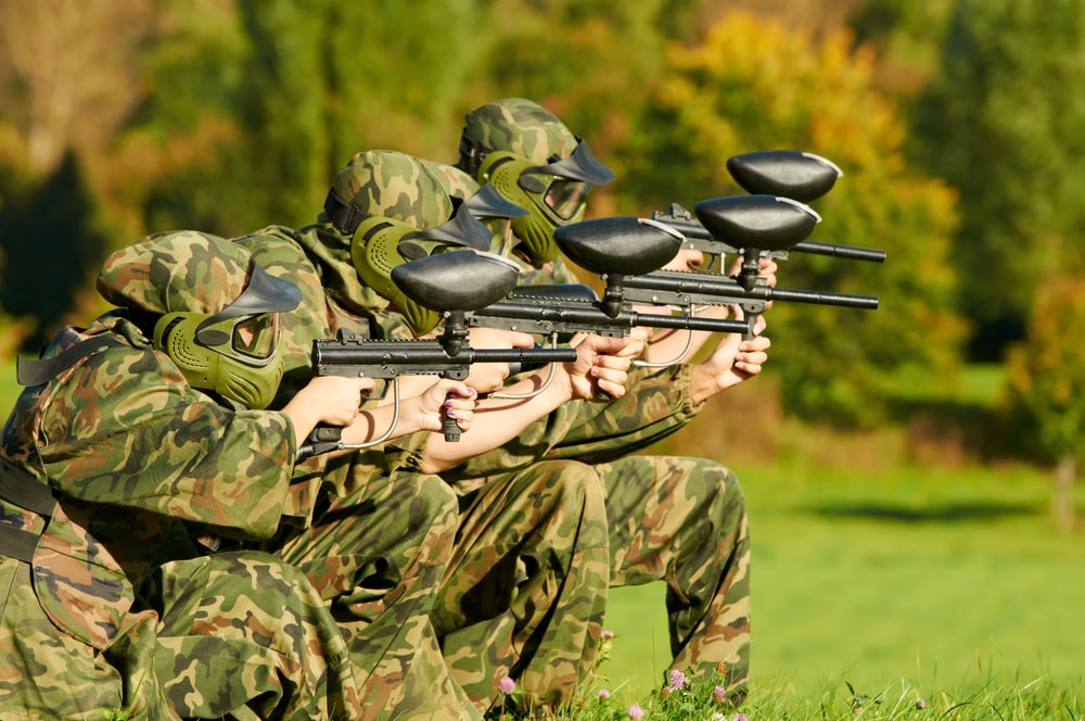 a paintball team coordinating.